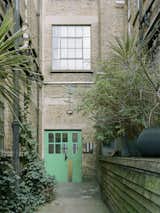 “The entrance is very unassuming,” says Jack. “It says ‘offices’ on the smaller building that faces the street, and the warehouse flats are set back. East London is quite busy, and walking in through the plant-filled courtyard makes our flat feel like a little oasis.”