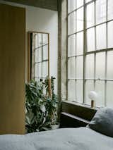 Alice and Jack chose neutral-colored, natural fabrics to soften the original concrete and steel.