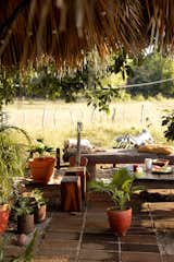 A palm palapa covered a patio area before Dani built the teak structure around the camper.