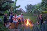 Friends gather for a fireside sing-along on Dani’s property.