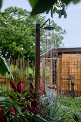An outdoor shower was provides a place to rinse off after a dip or surf in the ocean.