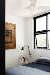 THIERY SIDE TABLE BY KARTELL FROM SPACE FURNITURE, MIDCENTURY 60’S ITALIAN GLASS FROM RUDI ROCKET, AND ELLIS OTTOMAN BY GRAZIA AND COLight touches make the minimal guest bedroom welcoming. The linen quilted bedcover and pillow cases are from Inbed Store.