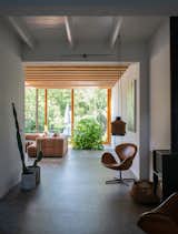 Inside, the transition between old and new is smooth, but not altogether seamless. HOP extended the concrete floor into the addition, but left a clear line to mark where the old floor ends and the new one begins.