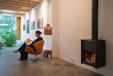 "There are so many seating areas in the house,  Photo 3 of 7 in Fireplace by Rachel Fingleton from My House: They Wanted the Perfect Art Gallery, So They Renovated Their Own Home