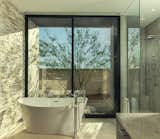 Bath Room, Stone Counter, Recessed Lighting, Travertine Floor, Open Shower, Freestanding Tub, Ceiling Lighting, and Stone Tile Wall  Photo 10 of 12 in TERRA by assemblageSTUDIO
