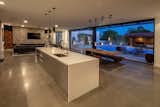 Kitchen, Concrete Floor, Dishwasher, Engineered Quartz Counter, Metal Cabinet, Ceiling Lighting, Undermount Sink, Pendant Lighting, Accent Lighting, and Recessed Lighting  Photo 12 of 21 in L House by assemblageSTUDIO