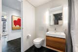 Bath Room, One Piece Toilet, and Concrete Floor Guest bath (en-suite to home theater/wall bed room).  Photo 19 of 32 in Art Stable | Modern Creator's Loft by Michael Doyle Properties