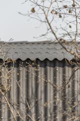 corrugated fiber cement cladding  has dual role on the building