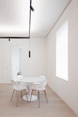 Dining Room, Chair, Table Lighting, Light Hardwood Floor, and Table  Photo 20 of 20 in High-Class Minimalism - Terézváros by Konkrét Stúdió
