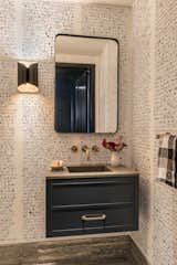 Bath Room, Recessed Lighting, Light Hardwood Floor, Pendant Lighting, Vessel Sink, and Stone Counter Downstairs bath with original art wall paper by Katie Merz  Photo 19 of 22 in Modernist Sanctuary in Boston by Lynn Eikenberry