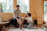 Living Room, Wall Lighting, Light Hardwood Floor, Accent Lighting, and Bench Formal living room bench and record player  Photo 2 of 32 in gatHER indie treehouse by Nikki McCall