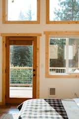 Bedroom with floor to ceiling windows