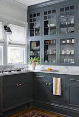 Updated kitchen refresh with Dolomite countertops and brass Rejuvenation hardware