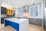 Kitchen, Refrigerator, Range, Range Hood, Cooktops, Colorful Cabinet, Beverage Center, Ice Maker, Dishwasher, Ceiling Lighting, and Microwave  Photo 11 of 16 in Regency House in Film-Worthy Neighborhood by Elizabeth Treadwell