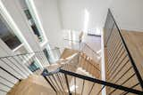 Staircase, Metal Railing, and Wood Tread  Photo 13 of 16 in Regency House in Film-Worthy Neighborhood by Elizabeth Treadwell