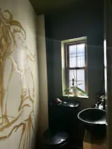 Small Restroom, where I like to have an unique design element. Here I went for a Greek goddess.