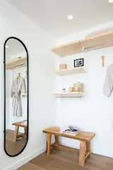 Open-concept closets in the guest rooms add a visual element and maximize space (credit: Josh Cho Photography)