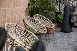 Outdoor seating brings a retro, modernist aesthetic to the pool deck (credit: Josh Cho Photography)