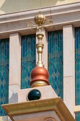 Blue reflected in Cinderella’s tower recalls the transformative ball gown she wears when she meets Prince Charming while the finial, a golden pumpkin coach, symbolizes her carriage.

Photo: ©Disney