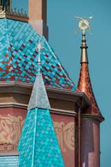 The storybook-inspired architecture of Anna and Elsa’s tower includes a light-blue shingled roof evocative of Elsa’s icy blue dress. The shimmering silver finial is a three-dimensional snowflake, an interpretation of Elsa’s magic and the snow that propels her adventure with Anna.

Photo: ©Disney