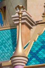 A Sundrop flower is the golden finial on Rapunzel’s turret, a glowing lily-like blossom that is the source of magic in this feisty heroine’s long, golden hair.  

Photo: ©Disney