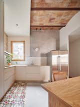 The renovation focused on the kitchen, where tile and brickwork play backdrop to considered, bespoke carpentry&nbsp;and microcement to create a minimalist yet warm kitchen area.&nbsp;