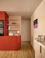 A small bedroom and guest toilet were sacrificed in order to create a curvacous transition from hall to kitchen area.