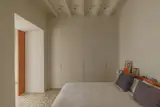 On the upper floor the layout remained unchanged. The couple enjoy seperate bedrooms, which was a stipulation when desigining their new home. On this floor, the original hydraulic tile flooring has remained.