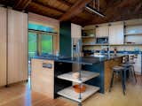 Pellegrino worked closely with the project's cabinetmaker and contractor on the kitchen's custom birch plywood cabinetry. She designed the floating and cantilevered shelves, for which the support of the plywood walls was essential.