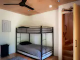 A staircase off the children's bunk room leads to the upstairs loft.