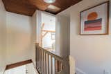 Original handrail and wood ceiling.