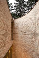 The exterior wall’s gentle curve conveys a sense of enclosure.