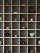 Julie Mølsgaard's clever cubic shelf hosts a rotating selection of Jette's ceramics, picked up from travels and auctions over the years.