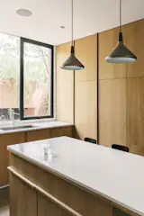 Natural oak forms the central element of the interior, complemented with elegant lighting features.
