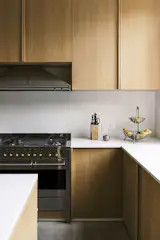 An uncluttered kitchen awaits use for hosting dinners among family and friends.