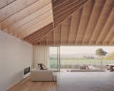 Warm Wood Finishes Sandwich the White Interiors of a Coastal Home in New Zealand - Photo 5 of 14 - 