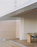 Warm Wood Finishes Sandwich the White Interiors of a Coastal Home in New Zealand - Photo 7 of 14 - 