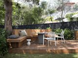 The outdoor dining nook echoes the interior curves in the back corner of the garden. "Built-in seats just generally give you more space, basically,