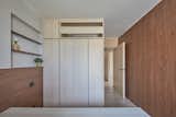 After: Now, dark oak offers respite for the eyes and a good nights' sleep for the busy parents.  Photo 21 of 23 in Before & After: Built-In Storage Unlocks the Potential of a Family’s Small Hong Kong Flat