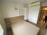 Before: An in-built bed and shelves fall short of making for a comfortable primary bedroom.  Photo 20 of 23 in Before & After: Built-In Storage Unlocks the Potential of a Family’s Small Hong Kong Flat