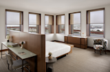 The generous scale of the corner king guest room reflects Becker + Becker’s adherence to the five-foot module laid out by Breuer for the existing building. Most hotel rooms are 12 feet wide, but the window placement at the Hotel Marcel dictates a 15-foot width for the larger guest rooms.