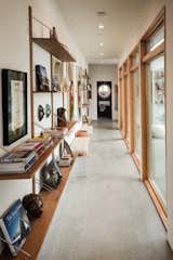 Hallway that links the living space with bedrooms and powder room, filled with art and books from the 50s, 60s and 70s.