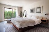 Master bedroom 2 with blackout and sheer curtains, large closet, private patio, and en suite bathroom. 