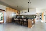 Kitchen with KitchenAid appliances and induction cooktop. Seating for 4 at counter and ample cooking space for nights in.