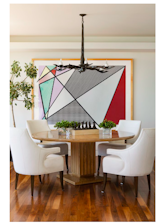 Dining Area- Bronze sculpture on dining table by Raphael Scorbiac, Artwork by Roy Lichtenstein, Bronze Chandelier by Jean De Merry, Chairs by Arbus, Roman-inspired dining table, reminiscent of Ruhlmann, custom designed by MWA