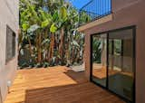 Sustainably harvested teak deck opens directly off the living room and kitchen and creates an outdoor dining room.