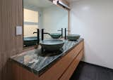 Primary bath with concrete vessel sinks on Quartzite counter with wood-look Wall tile.