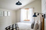 Airbnb guests will find creative handmade touches throughout Alpenglow Cabin like wooden headboards, Colorado wildflower botanical prints sourced from Etsy, pillow covers, local pottery, and more.