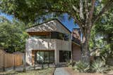 Matt Fajkus Architecture maintained large trees surrounding its Hewn House project to allow for ample shade.