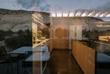 Reflections of the surrounding cliffs are ever-present in the home’s glass surfaces.

